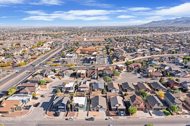 view of property location featuring nearby suburban area and a mountainous background