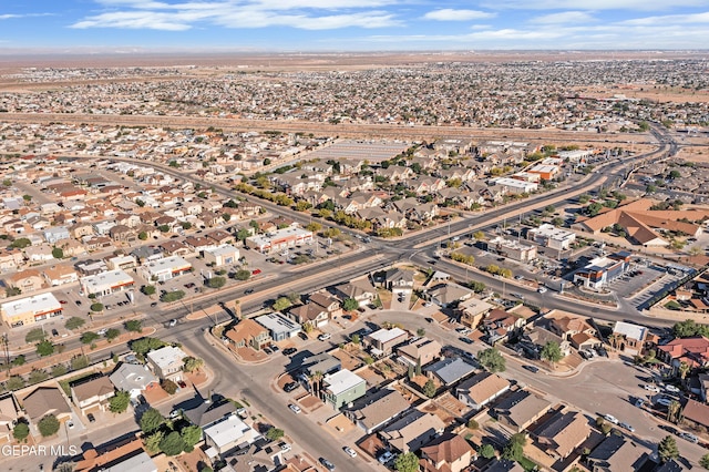 aerial view of property and surrounding area with nearby suburban area