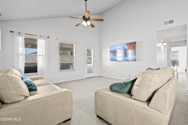 carpeted living area with ceiling fan, high vaulted ceiling, and baseboards