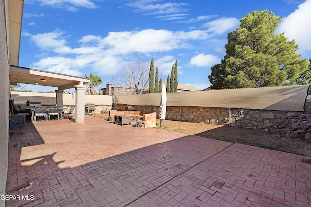 view of patio / terrace featuring outdoor dining area and a fenced backyard
