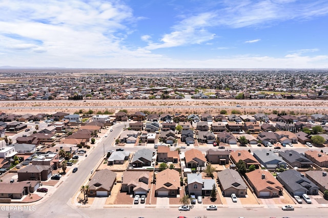 birds eye view of property with a residential view