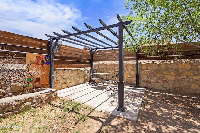 view of patio featuring a pergola and a fenced backyard