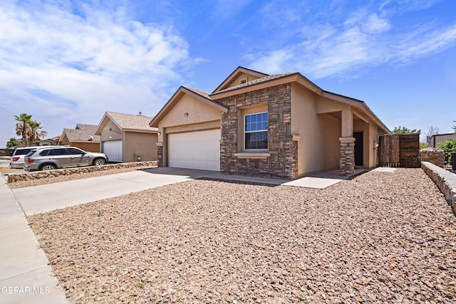 view of front of home featuring stone siding, concrete driveway, stucco siding, and a garage