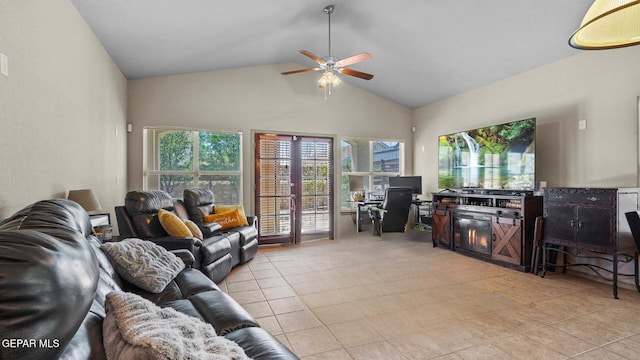 living area with high vaulted ceiling, a ceiling fan, and light tile patterned floors