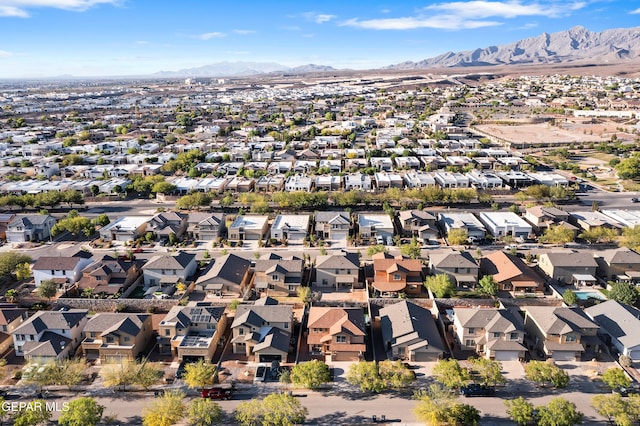 7337 Autumn Sage Dr, El Paso, TX 79911 - aerial overview of property's location with mountains and nearby suburban area
