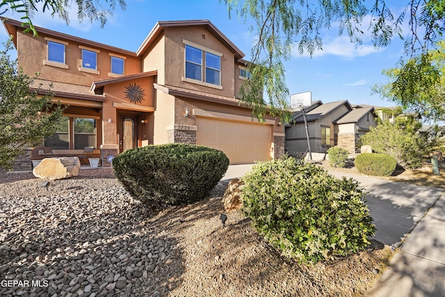 7337 Autumn Sage Dr, El Paso, TX 79911 - view of front of property featuring stucco siding, an attached garage, and stone siding