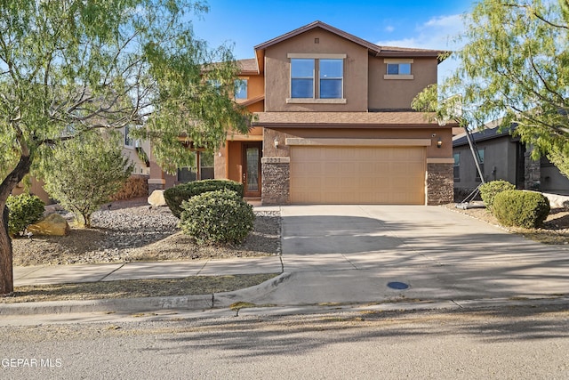 7337 Autumn Sage Dr, El Paso, TX 79911 - view of front facade with driveway, stucco siding, a garage, and stone siding