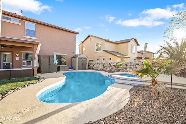 7337 Autumn Sage Dr, El Paso, TX 79911 - view of swimming pool with a shed, a pool with connected hot tub, and a patio