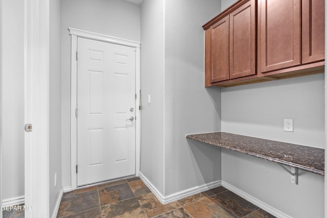 7337 Autumn Sage Dr, El Paso, TX 79911 - mudroom featuring stone tile flooring and built in desk