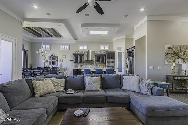 668 Darlington, El Paso, TX 79928 - living area with a tray ceiling, recessed lighting, wood finished floors, and ceiling fan with notable chandelier