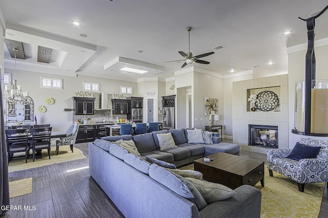 668 Darlington, El Paso, TX 79928 - living area featuring recessed lighting, a fireplace, visible vents, and ceiling fan with notable chandelier