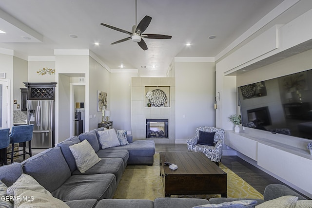 668 Darlington, El Paso, TX 79928 - living area with wood finished floors, ornamental molding, recessed lighting, a ceiling fan, and a tile fireplace