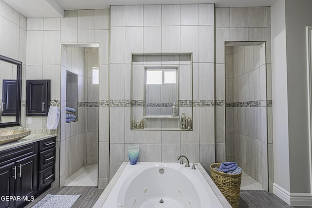 668 Darlington, El Paso, TX 79928 - bathroom featuring a walk in shower, vanity, and a whirlpool tub