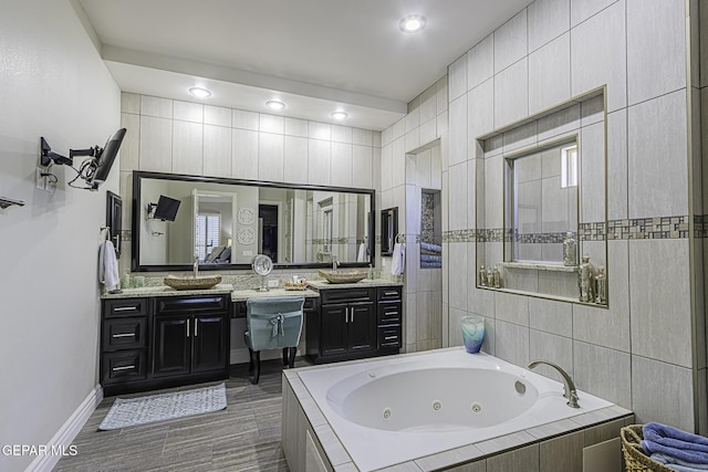 668 Darlington, El Paso, TX 79928 - full bathroom featuring vanity, a jetted tub, and baseboards