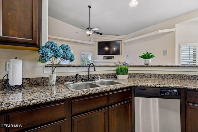 kitchen with dark brown cabinets, ceiling fan, dishwasher, a sink, and lofted ceiling