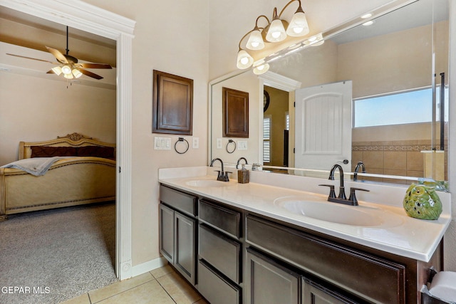 full bath featuring double vanity, a sink, ceiling fan, and tile patterned floors
