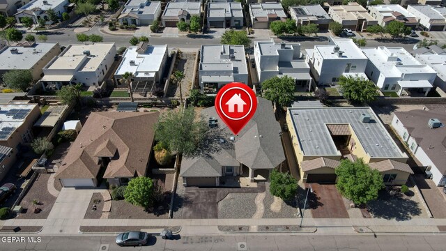 birds eye view of property with a residential view
