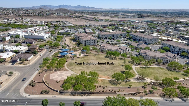 birds eye view of property with a mountain view