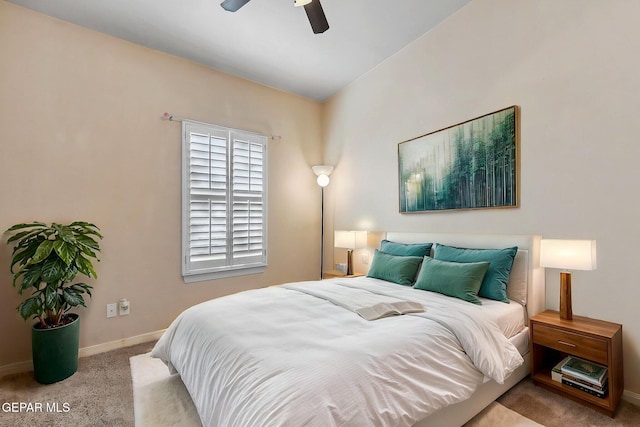 bedroom with ceiling fan, baseboards, and carpet floors