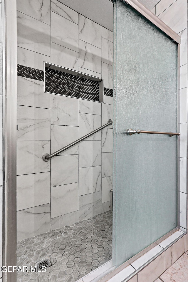 full bathroom featuring a shower stall
