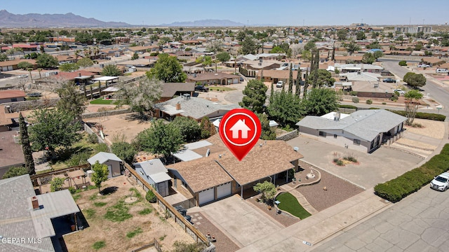 bird's eye view featuring a residential view and a mountain view