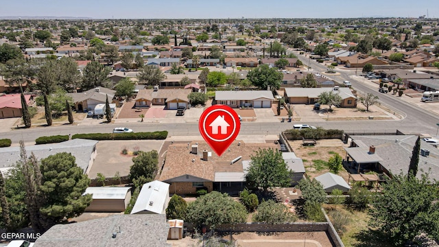 birds eye view of property with a residential view