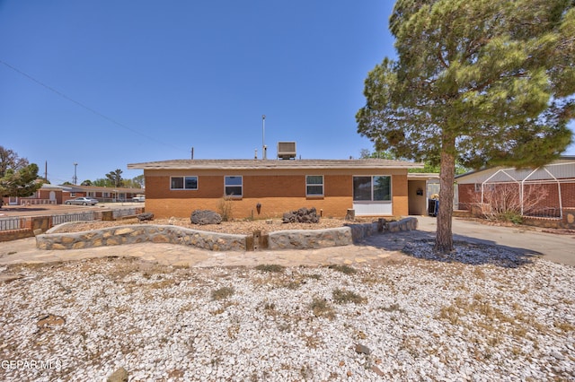 5201 Capistrano Dr, El Paso, TX 79924 - back of house with driveway and brick siding