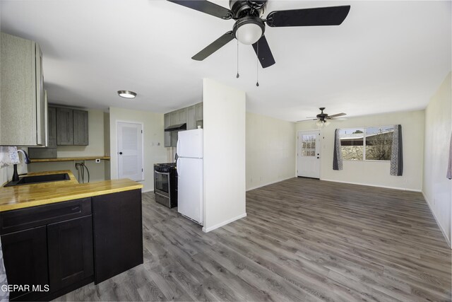 5201 Capistrano Dr, El Paso, TX 79924 - kitchen featuring a sink, ceiling fan, freestanding refrigerator, stainless steel gas stove, and baseboards