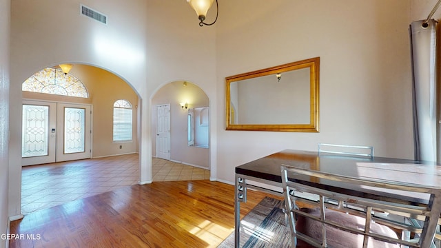 2088 Crystal Ridge St, El Paso, TX 79938 - interior space with arched walkways, tile patterned floors, french doors, a towering ceiling, and visible vents
