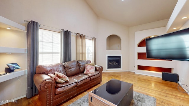 2088 Crystal Ridge St, El Paso, TX 79938 - living room featuring baseboards, a fireplace, and wood finished floors