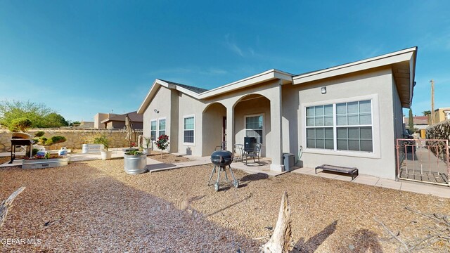 2088 Crystal Ridge St, El Paso, TX 79938 - rear view of house featuring fence, a patio area, and stucco siding
