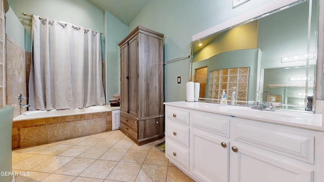 2088 Crystal Ridge St, El Paso, TX 79938 - bathroom with tiled shower / bath, vaulted ceiling, tile patterned flooring, and vanity