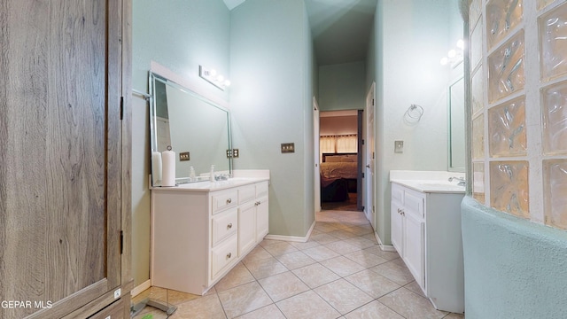 2088 Crystal Ridge St, El Paso, TX 79938 - ensuite bathroom featuring connected bathroom, a sink, tile patterned floors, baseboards, and two vanities