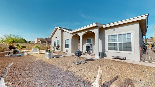 2088 Crystal Ridge St, El Paso, TX 79938 - rear view of house with a patio, stucco siding, and fence