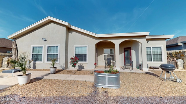 2088 Crystal Ridge St, El Paso, TX 79938 - back of property with a patio and stucco siding