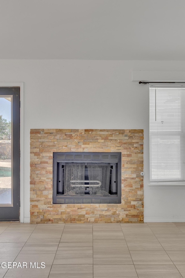 interior details with a fireplace and baseboards
