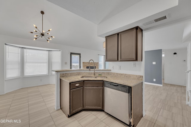 kitchen with lofted ceiling, dishwasher, an inviting chandelier, visible vents, and a sink