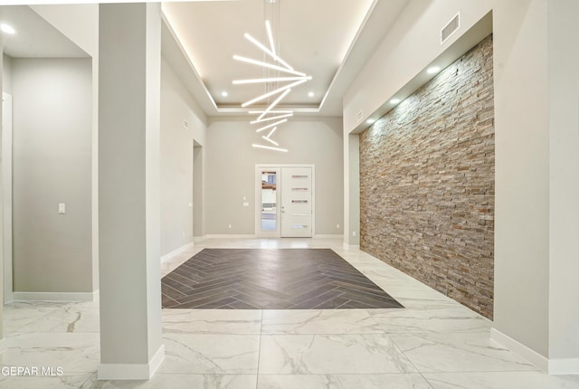 building lobby featuring visible vents