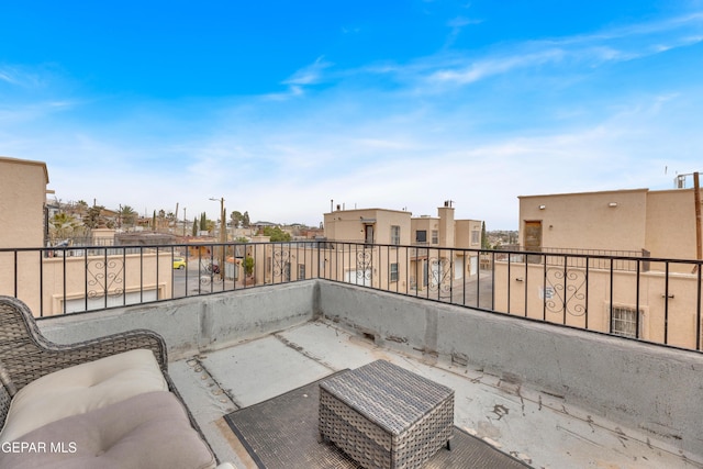 view of patio / terrace with a residential view and a balcony