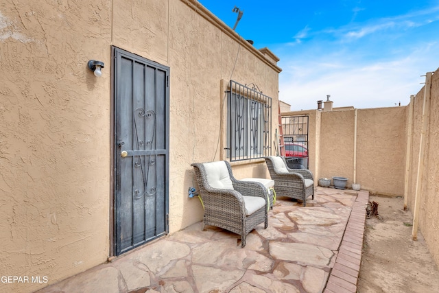view of patio featuring fence