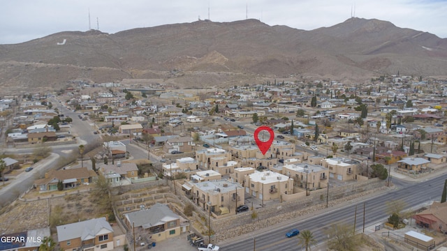 birds eye view of property featuring a mountain view and a residential view