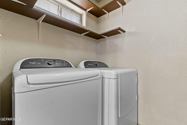 washroom featuring independent washer and dryer and laundry area