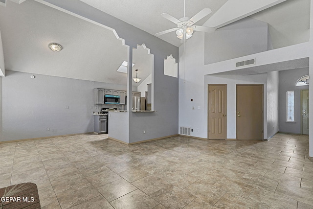 unfurnished living room with visible vents, a ceiling fan, high vaulted ceiling, and baseboards