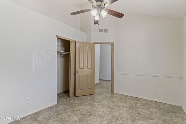 unfurnished bedroom featuring visible vents, a closet, baseboards, a ceiling fan, and high vaulted ceiling