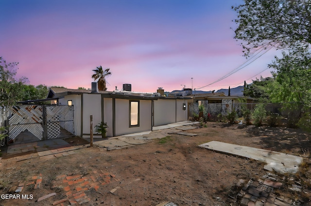 back of house featuring fence