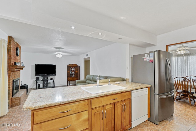 316 Garden Grove Ln, El Paso, TX 79912 - kitchen with a ceiling fan, open floor plan, dishwasher, and a sink