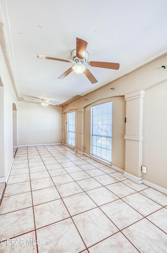 11144 Perlette St, Socorro, TX 79927 - spare room with baseboards, light tile patterned floors, ceiling fan, and ornamental molding