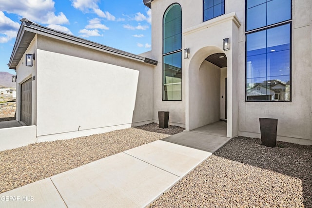 doorway to property with stucco siding