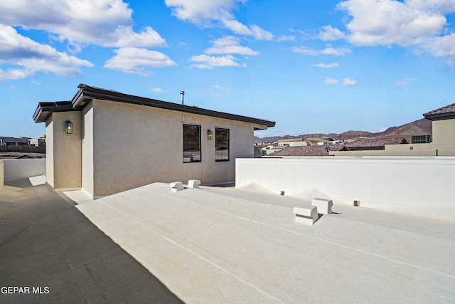 back of property featuring a patio and stucco siding