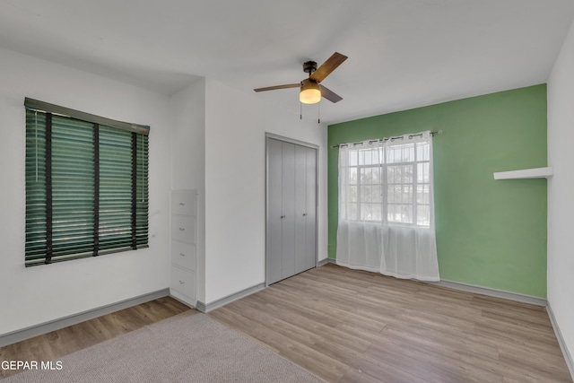 1003 Alethea Park Dr, El Paso, TX 79902 - unfurnished bedroom with a closet, a ceiling fan, baseboards, and wood finished floors